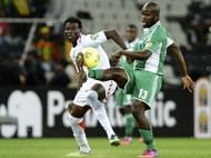 Nigeria's Fegor Ogude (R) vies with Burkina Faso's Ahmed Musa at Mbombela Stadium in Nelspruit on January 21, 2013